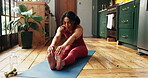 Home, yoga mat and woman stretching for morning routine, fitness and posture for holistic self care. Wellness, pilates and person with forward bend exercise for flexibility challenge, peace and calm