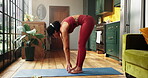 Fitness, stretching and woman with exercise mat in home, morning yoga routine or posture for wellness. Holistic self care, pilates and person with forward bend for flexibility, body goals or balance