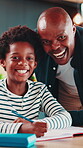 Face, father and son in house with homework for education support, academic growth and happiness. Black family, parent and child smile with school notebook for advice, study and learning development.