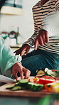 Cooking, hands of mother and kid with meal prep for healthy dinner, vegetable knowledge or support. Family, child or mom cut ingredients in home for lunch recipe, bonding or food education in kitchen