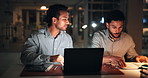 Laptop, men and notebook with discussion at night for story ideas, editorial planning and feedback. Publishing agency, journalist or editor with tech for breaking news coverage, teamwork and deadline