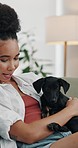 Relax, cuddle and woman with puppy on sofa for connection, smile and bonding. Animal care, loyalty and affection with female person and dog in living room of home for foster pet, calm and comfort 