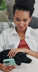 Puppy, stroke and woman with phone on sofa for pet insurance, animal website and weekend break. Bonding, dog mom and smile with smartphone in home for adoption application, training tips or companion