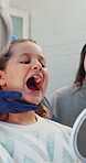 Advice, inspection and mirror with child at dentist office for oral hygiene, teeth whitening and cleaning. Dental appointment, gum health and checkup with people for consulting and orthodontist
