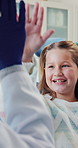 Dentist consultation, office or happy girl with high five, calm or ready for tooth extraction procedure. Trust, well done or people at dental visit for teeth cleaning, orthodontist or good behavior