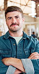 Man, face or carpenter with confidence for woodwork, timber service or furniture business. Portrait, male person or artisan with smile or arms crossed for lumber skill, craft or carpentry in workshop