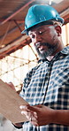 Black man, carpenter and clipboard with checklist for inventory, project or woodwork in warehouse. Male person, carpentry or list in furniture business for wood construction or stock check in depot
