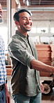 Businessman, carpenter and handshake with team in woodshop for agreement, partnership or success. Male person, colleagues or woodworker shaking hands with smile for DIY project or furniture business