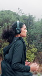 Healthy, running and woman with fitness, headphones and sports with workout, training and routine. Person, runner and athlete with cardio, audio tech and endurance with challenge, energy and morning