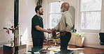 Meeting, men and handshake with entrepreneur, barbershop and funding opportunity for startup or deal. Happy, people and shaking hands for investment in salon, partnership and gesture for achievement