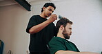 Worker, customer and comb hair in barber shop for maintenance, makeover or styling appointment. People, professional hairstylist or grooming in small business with cosmetic tool, treatment or service