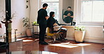 Barbershop, haircut and man with barber, talking and consultation for hair maintenance and grooming. Salon, hairdresser and people with equipment for hairstyle, appointment and discussion with client