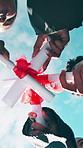 Graduation, below and hands of students with certificate for education success, college and achievement, University, circle and friends with degree for celebration, learning and graduate outdoor