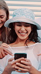 Laughing, phone and pointing with people outdoor together for reaction to meme or social media. App, funny and text message with happy friends typing on mobile for communication or post sharing