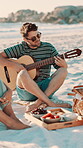 Beach, friends or man play guitar with sunglasses, summer vacation or holiday with musical entertainment. Picnic trip, outdoor reunion or happy musician with acoustic performance, singing or people