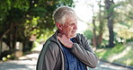 Senior man, neck pain and neighborhood with injury on road for workout accident or emergency. Elderly, male person or sore joint with shoulder for muscle tension, bruise or sprain on street in town