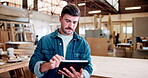 Woodworker, man and scroll in workshop with tablet, building project info or manufacturing research. Person, reading and plan in factory with tech for carpentry idea, furniture production and repair.