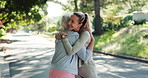Personal trainer, hug and support with elderly woman in park for mobility training, health or workout team. Friends, success and female fitness coach with senior person in nature for exercise help