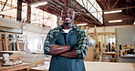 Face, happiness and man with arms crossed, carpentry and furniture industry with career ambition. Entrepreneur, person and professional in workplace, smile or pride with manufacturing and production