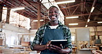 Happy man, carpenter and tablet at warehouse, face or check notification with furniture manufacturing. African person, technician and portrait with smile for project, app or design review in Nigeria
