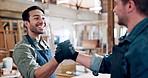 Handshake, support and carpenter with people in warehouse for furniture deal, woodworking or agreement. Manufacturing partner, hand gesture and project contract with employees for timber production