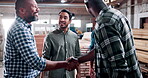 Handshake, team and manufacturing with people in warehouse for furniture deal, woodworking or agreement. Carpenter partner, shaking hands and project contract with employees for timber and production
