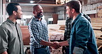 Handshake, greeting and carpenter with people in warehouse for furniture deal, woodworking or agreement. Manufacturing partner, shaking hands and project contract with employees for timber production