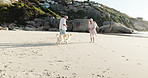 Beach, vacation and old couple with dog, playing and people with pet in nature, romance and running. Outdoor, elderly man and fun with senior woman, retirement and happy with domestic animal on trip