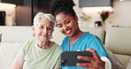 Old woman, nurse and selfie on couch, happy and hug with bonding, memory and retirement in home. People, caregiver and profile picture with embrace, photography or social network on sofa at house