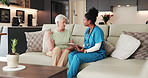 Senior woman, nurse and tablet on sofa, discussion and assessment for neck pain in retirement home. People, caregiver and tech with assisted living, application and consultation on couch at house
