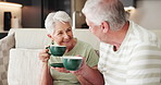 Home, coffee and old couple on sofa, relax and bonding together with smile, love and trust. Apartment, man and woman on couch, caffeine or retirement with break, herbal tea or funny with relationship