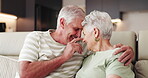 Happy, senior couple and hug in lounge, people and bonding with smile in house, retirement and love. Home, elderly man and relax with old woman in living room, affection and romance with partner
