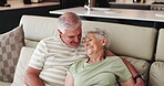 Retirement, senior couple and laugh in lounge, people and bonding with smile in house, hug and above. Happy, elderly man and relax with old woman in living room, affection and romance with partner
