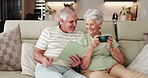 Elderly couple, relax and tablet on sofa for social media, streaming or subscription in living room. Old man, woman or senior people in house together for retirement, bonding and beverage with tech