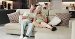 Old couple, relax and tablet on couch for social media, streaming or subscription in living room. Elderly man, woman or senior people in house together for retirement, bonding and beverage with tech