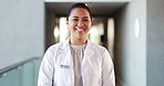Doctor, healthcare and happy woman in hospital, face and confidence with career ambition. Portrait, employee and professional in clinic, wellness and medical service with pride and cardio specialist