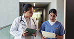 Doctors, talk and women with document, hospital or mentor with advice for patient care and treatment. Hallway, surgeon and people with tablet for medical records, discussion and healthcare in clinic