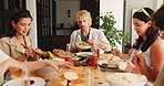 Break, food and social gathering with friends at dining table in home for bonding or reunion. Celebration, cookout and lunch with group of happy people in apartment for eating, feast or meal