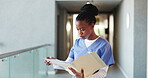 Nurse, folder and feedback with black woman in hospital for patient history portfolio, medical report and planning. Surgery schedule, checklist and healthcare diagnosis with low angle of person