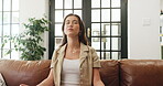 Meditation, calm and peace with woman on sofa for yoga, breathing exercise, spirituality and aura. Wellness, balance and holistic self care with person in living room of home for relax and zen