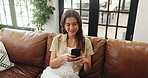 Smile, woman and relax with phone on sofa for social media, browsing website and texting. Above, female person or happy with mobile, reading ebook and notification update of message response at house