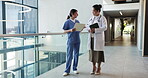 Hospital, doctors and women with folder, explain and preparing for medical procedure with documents. Clinic, surgeon and advice for treatment plan with patient report, conversation and collaboration