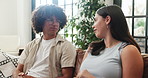 Couple, relax and talk on sofa in home for first date, explain interests and bonding together. People, rest and discussion on couch for commitment, romantic conversation and connection in living room