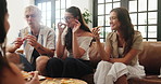 Eating, friends and people on sofa, pizza party and bonding together with social gathering. Home, men and women with snack, relax or celebration with break, fast food and eating with lunch and smile