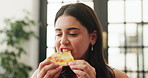 Happy woman, eating and pizza with bite, fast food or takeout for meal, snack or cheese slice in home. Female person, relax and hungry with smile or pastry for delicious Italian recipe in house