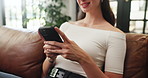 Mobile, hands and woman in home for relax, communication app or social media with comment post. Cellphone, typing and happy person on sofa for online dating, chat or browsing with internet search