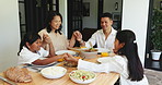 Lunch, family and holding hands for prayer in home, grace and bless meal with parents. Mother, father and children praying in dining room with food for thanksgiving, gratitude and happy together