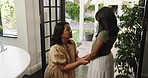 Mother, talking and holding hands with child at house for love, guidance and emotional support. Woman, kid and discussion for good behaviour with reassurance, giving advice and teaching boundaries