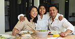 Hug, face and Asian family at table with meal, bonding together and healthy food in social gathering. Smile, parents and daughter in house with embrace, lunch cuisine and nutrition plate in tradition