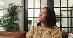 Woman, thinking and happy on sofa in home, relax and reflection for memory with nostalgia in living room. Person, smile and perspective on couch with inspiration, remember or chill in lounge at house